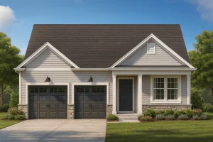 Front view of a Traditional Ranch style home featuring gray horizontal lap siding, stone accents, and a two-car garage under a symmetrical gable roofline