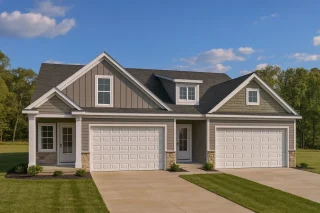 Front view of a Modern Farmhouse with Craftsman details featuring board and batten siding, stone accents, and a three-car garage under a steep gable roofline