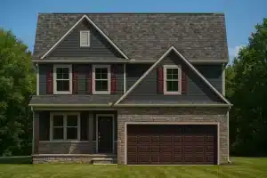 Front elevation of a Traditional Suburban two-story home featuring horizontal siding, stone accents, shingle roofing, and a prominent double garage