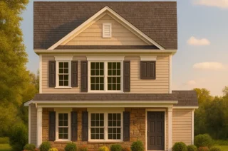 Front view of a Traditional Colonial home with horizontal siding, stone veneer accents, and symmetrical windows with shutters