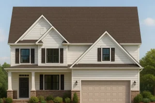 Front view of a two-story Traditional Farmhouse Colonial home featuring horizontal siding, stone wainscoting, and a gable roof with dark shingles