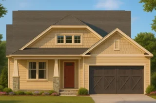 Front view of a Craftsman Cottage style home featuring warm siding, stone column bases, and a welcoming covered porch entry