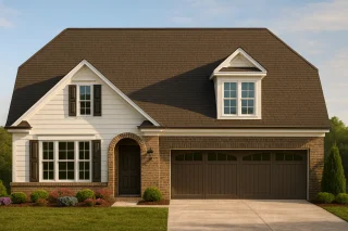 Front view of a Traditional Colonial Revival home with brick and horizontal siding, arched entryway, dormer windows, and double garage.