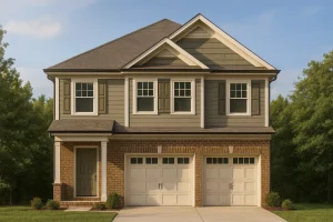 Front elevation of a Traditional Colonial style home featuring a brick first floor, lap siding upper level, and double garage with symmetrical design.
