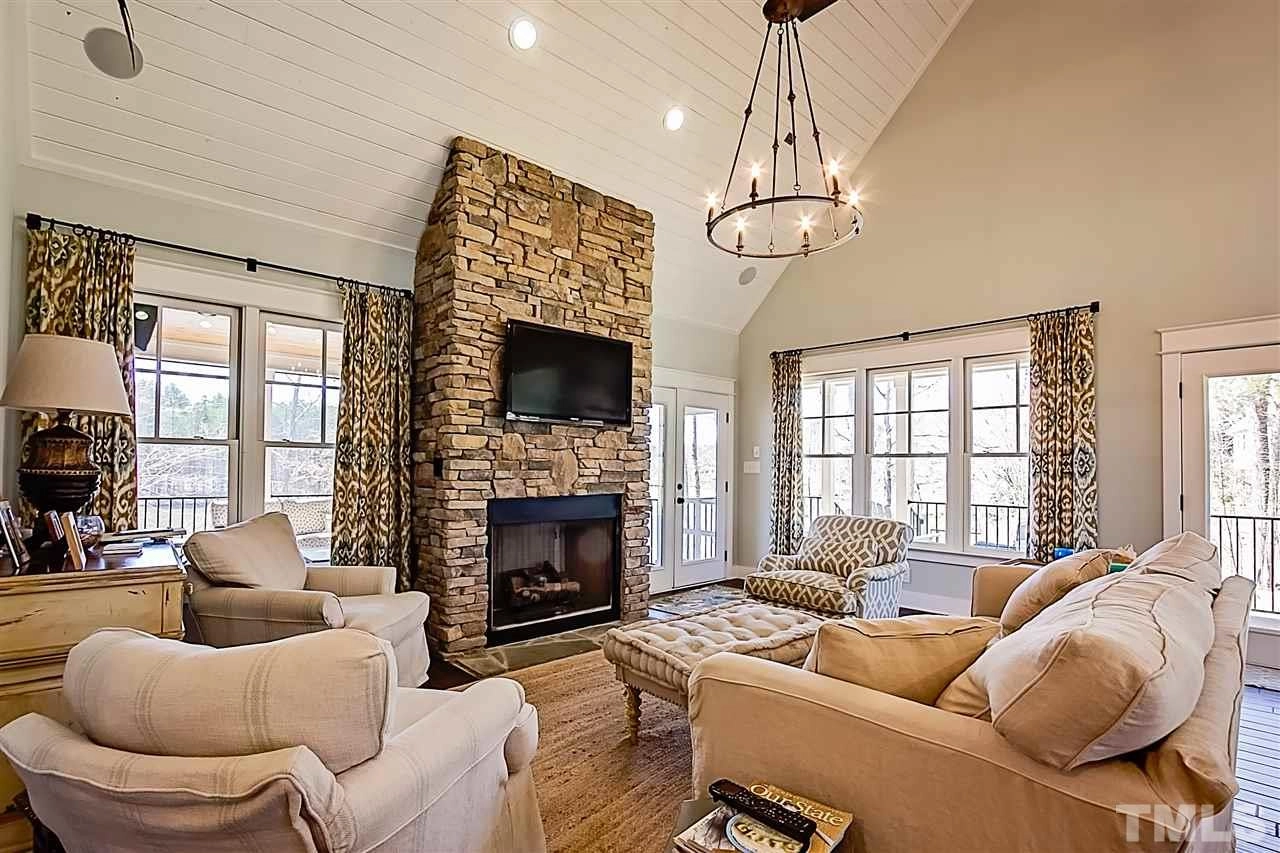 foothills-cottage-plan-vaulted-living-room-stone-fireplace
